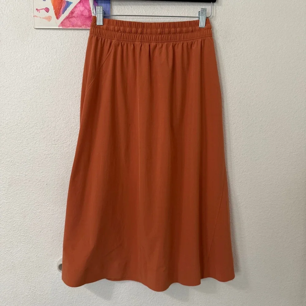 Athleta A-Line Midi Skirt 4 Womens Burnt Orange Zipper Pockets Elastic Earthy